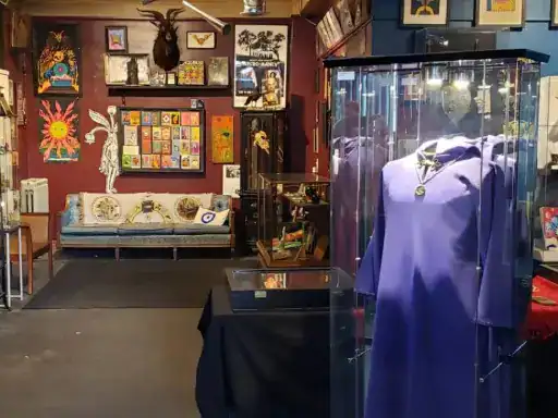 An art gallery shows off unique art, cozy furniture, and special collectibles. J&P Coatings’ quality flooring adds to the welcoming setting.