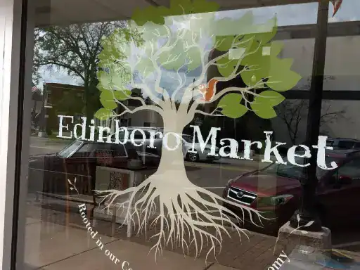 A window shows the “Edinboro Market” decal, highlighting a business completed by J&P Coatings.