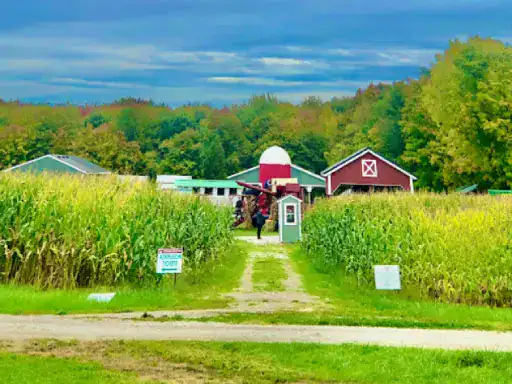 Text conveys a peaceful farm where people gather by a barn. J&P Coatings’ concrete patio coatings are featured near the entrance.