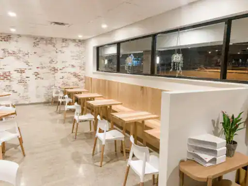 This image shows a clean, comfortable café that highlights the quality work done by J&P Coatings.