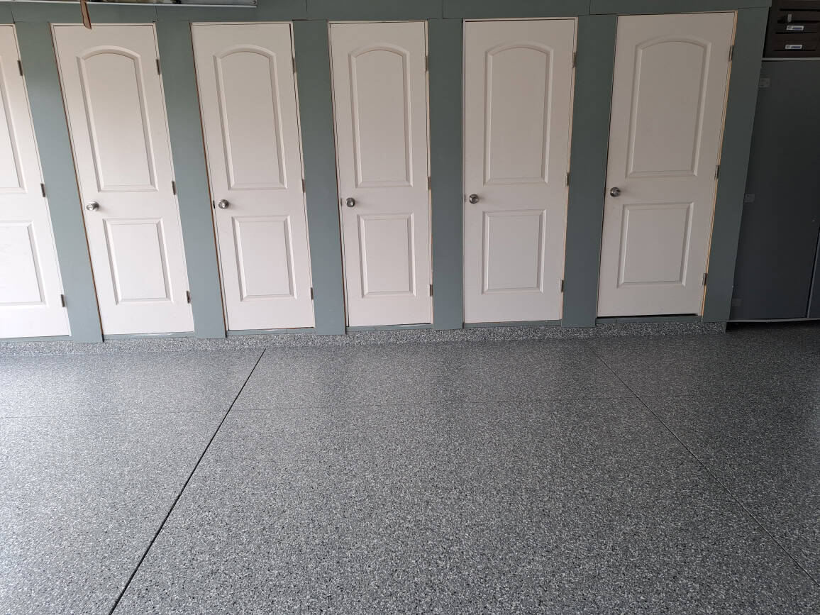 This image shows a clean, organized space with expertly finished flooring by J&P Coatings.