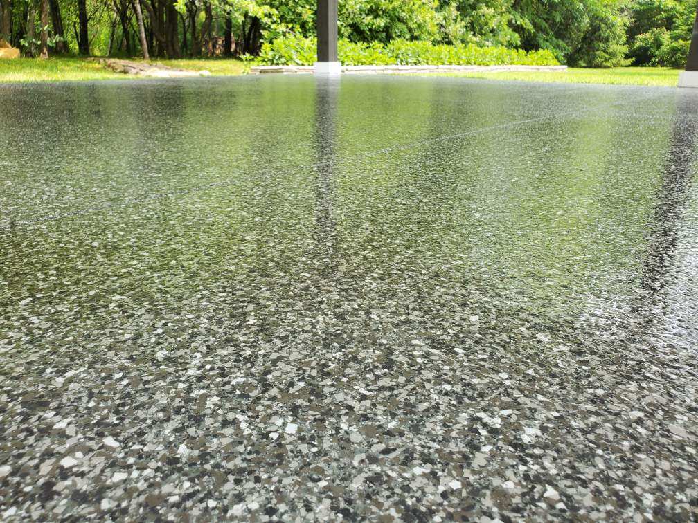 This photo shows a smooth concrete floor finished by J&P Coatings. The polished surface highlights their quality work.