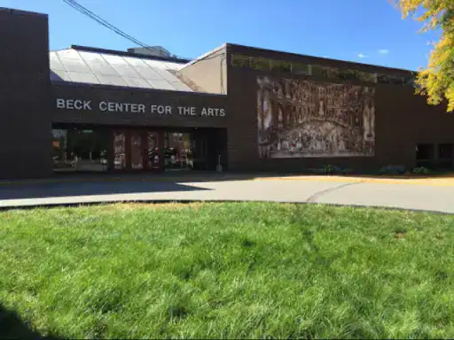 The Beck Center for the Arts is shown as a welcoming community building with top-quality basement floors finished by J&P Coatings. The space looks well cared-for and inviting.