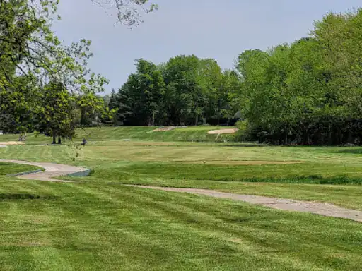 A well-kept golf course shows off smooth paths, healthy grass, and tidy surroundings thanks to J&P Coatings&rsquo; concrete sealing.
