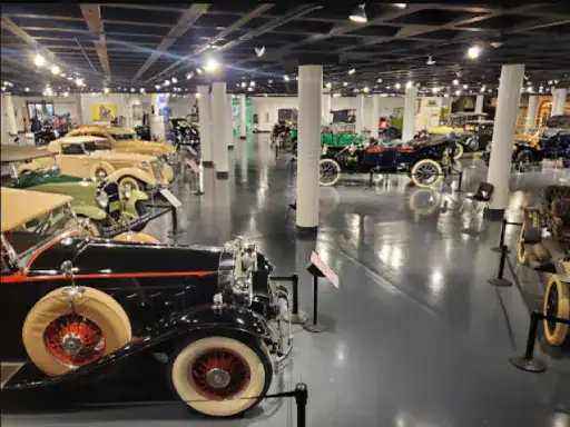 A museum with many vintage cars stands out for its shiny floors finished by J&P Coatings, making the space feel clean and welcoming.