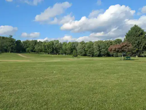 A calm, sunny landscape that reflects the peaceful results J&P Coatings delivers for Ohio spaces.