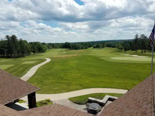A golf course with paths shows how outdoor spaces can benefit from strong concrete coatings, like those from J&P Coatings.