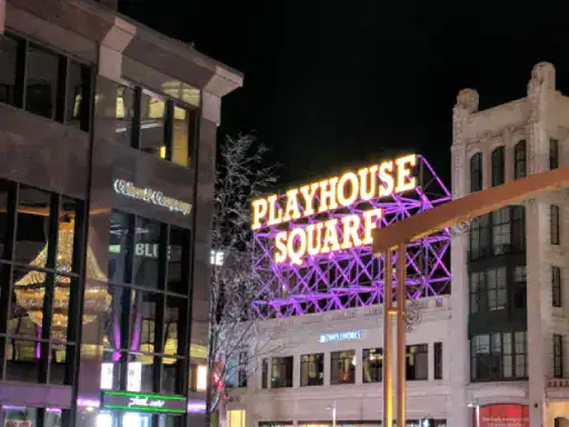 The scene captures the excitement and energy of Playhouse Square at night. The glowing chandelier represents unique inspiration for J&P Coatings, your trusted choice for basement flooring.