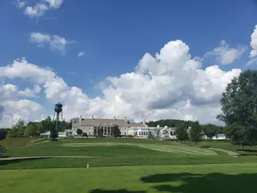 This image shows a welcoming clubhouse and water tower, highlighting J&P Coatings’ reliable flooring services for large buildings.