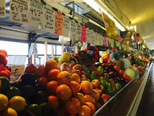An inviting market stall shows the fresh and lively look J&P Coatings brings to outdoor concrete patios.