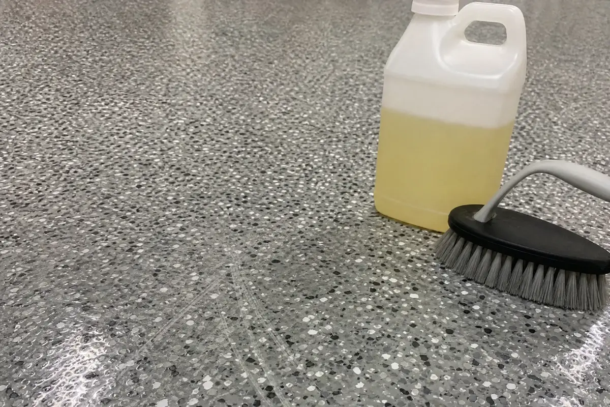 J&P Coatings cleaning supplies are set out and ready to use for washing the floor.